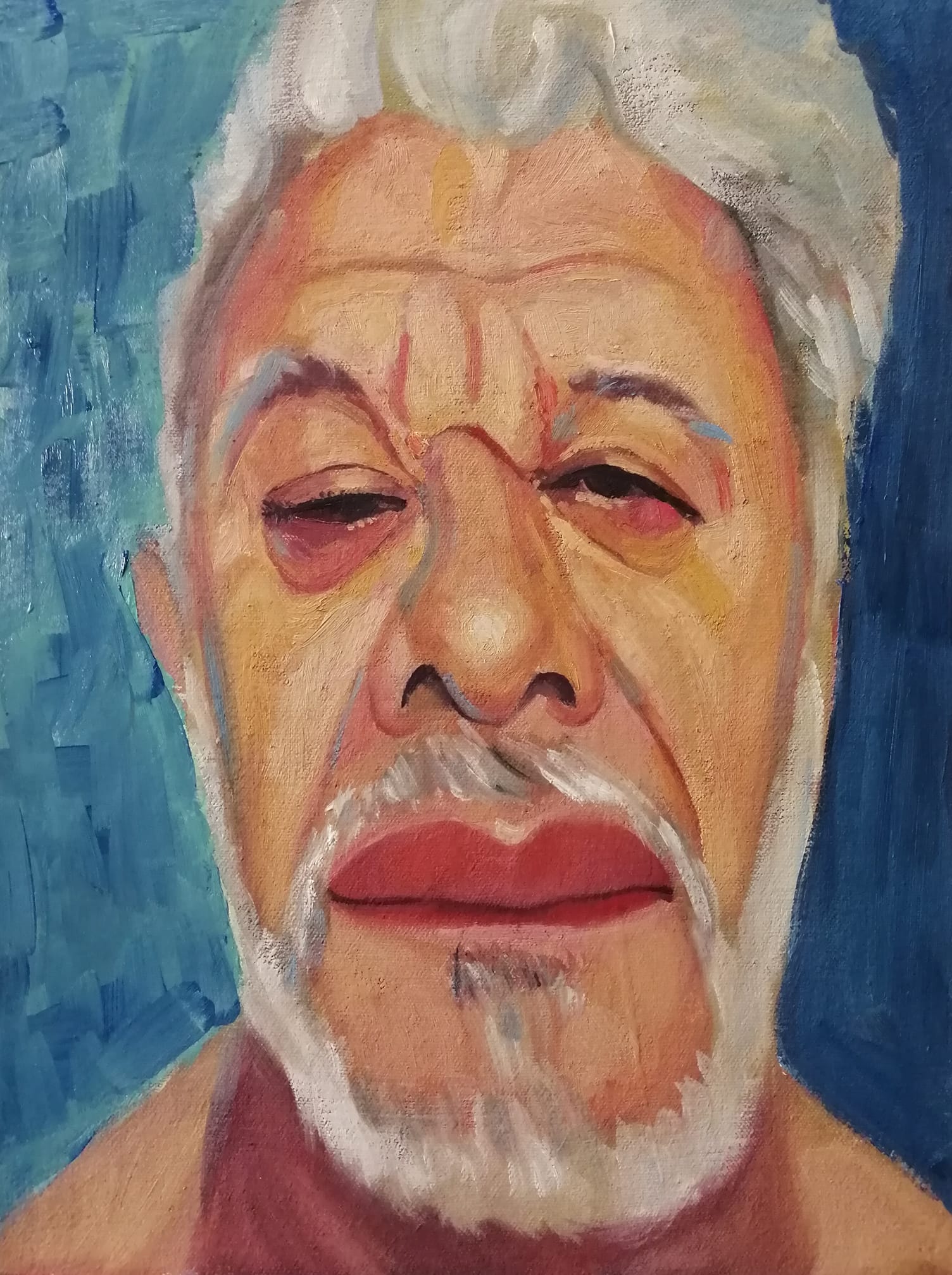 Autorretrato del artista sobre fondo azul